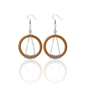 silver chain and brown ring handmade niniwear earrings on white background